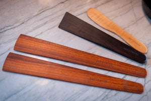 4 piece thin wood spatula, scraper, cheese spreader set on marble counter - Earlywood