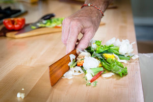 using long edge of Earlywood spatula as a wood bench scraper