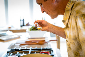 tasting soup with long thin wood sampling spoon - earlywood